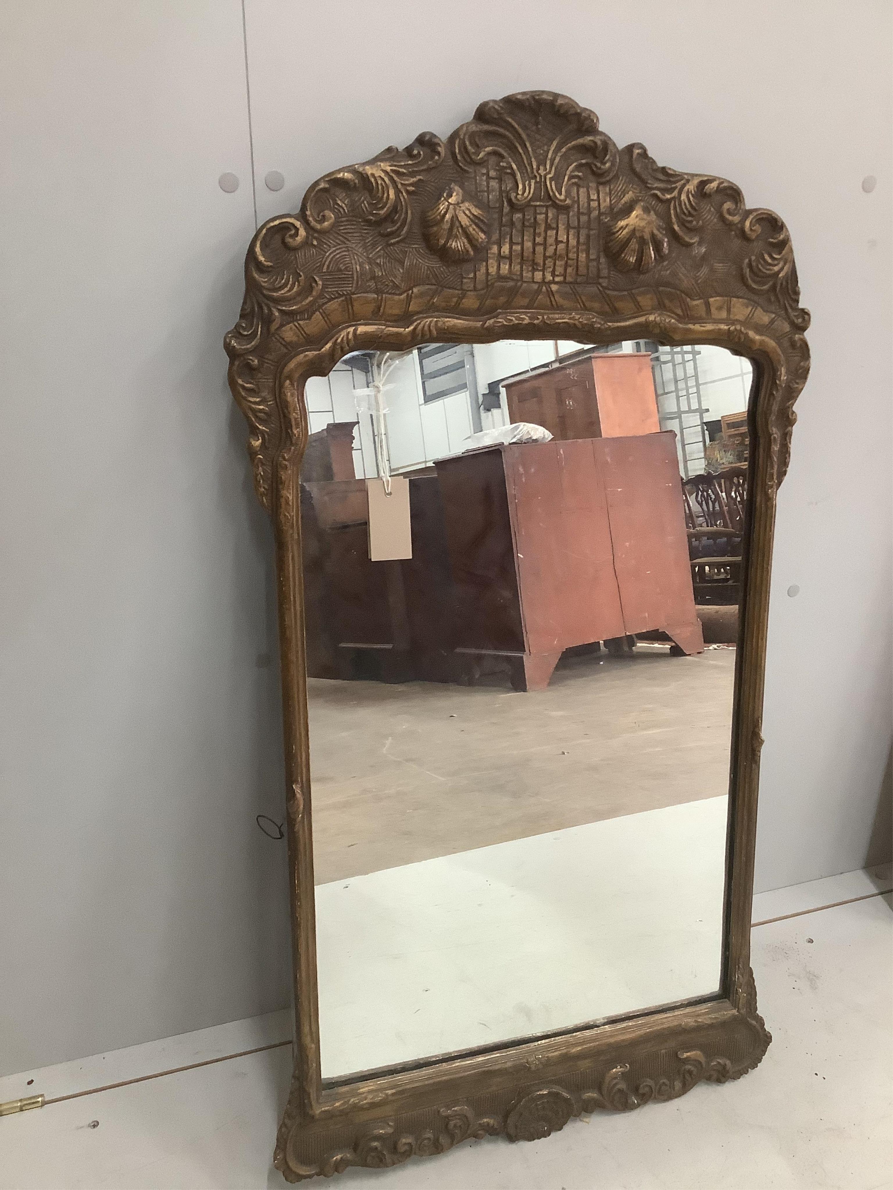 An 18th century style gilt composition wall mirror, width 54cm, height 100cm together with a reproduction Victorian style wall mirror. Condition - fair